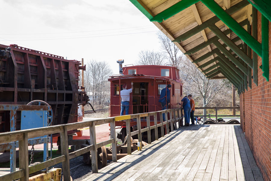 Workers restore a historic Long Island Rail Road train at the Railroad Museum of Long Island in Greenport, preserving the region’s railroading heritage for future generations. F