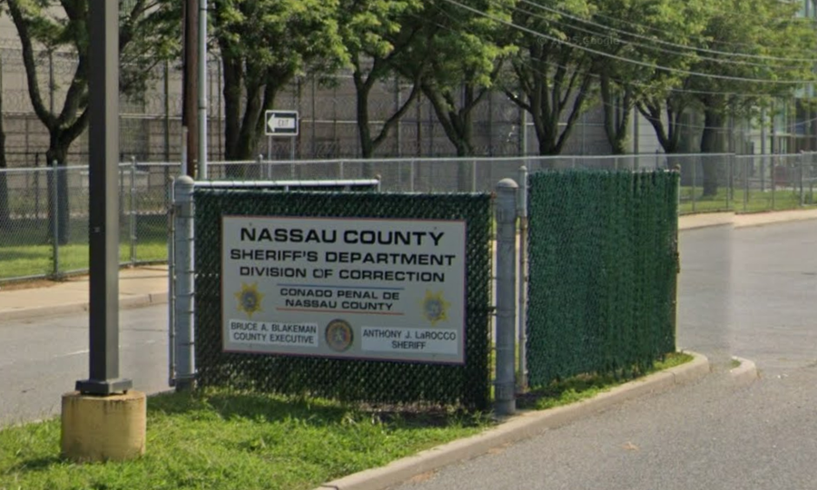 Exterior view of the Nassau County Correctional Center in East Meadow, Long Island, showing the facility entrance and perimeter security fencing along Carman Avenue. Image captured via Google Street View. Courtesy of Google Street View.