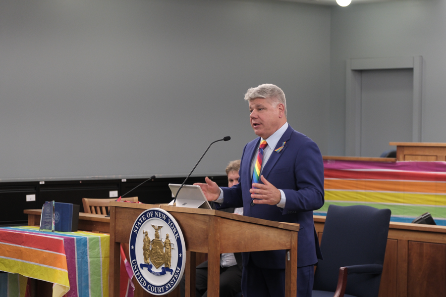 District Administrative Judge Andrew Crecca gives welcoming remarks at the court’s Pride Ceremony.