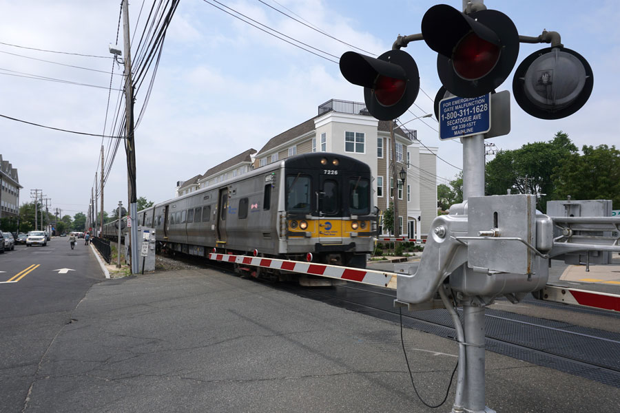 A Long Island Rail Road train passes through the Farmingdale station area, one of the busiest transportation hubs in central Long Island. The station provides convenient rail service between Nassau County, Suffolk County, and New York City while helping connect residents and visitors to Farmingdale's vibrant downtown district.