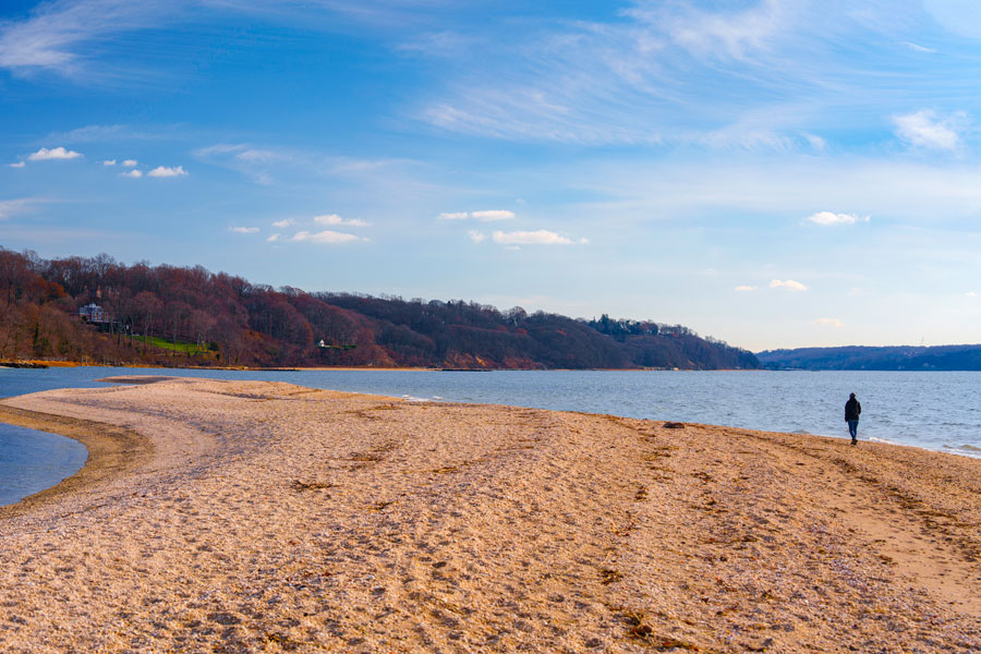 Lloyd Neck Beach in Long Island, Lloyd Harbor, New York, USA: A tranquil panoramic seascape on a cloudy winter day