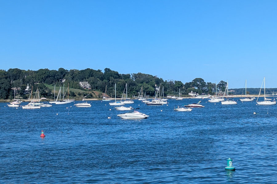 Boats rest peacefully on the calm waters of Oyster Bay Harbor on Long Island’s North Shore. Surrounded by wooded shorelines, waterfront estates, and scenic harbor views, Oyster Bay Harbor remains one of Nassau County’s most historic and picturesque boating destinations.