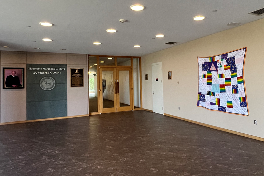 collaborative display of fabric squares created by members of the court community containing messages of hope, love, and acceptance, on display on the second floor mezzanine of the John P. Cohalan Jr. Court Complex.