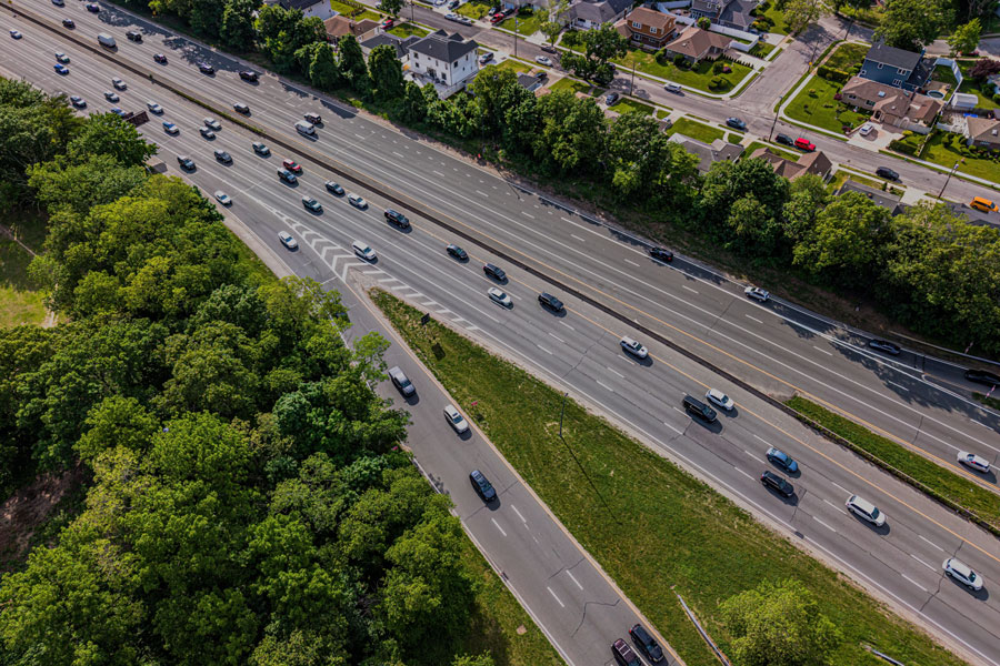 An aerial view of the Southern State Parkway near Valley Stream State Park highlights the park's location within one of Long Island's most densely developed suburban corridors. The park's wooded landscapes and recreational areas provide valuable green space for residents of Valley Stream and neighboring communities.
