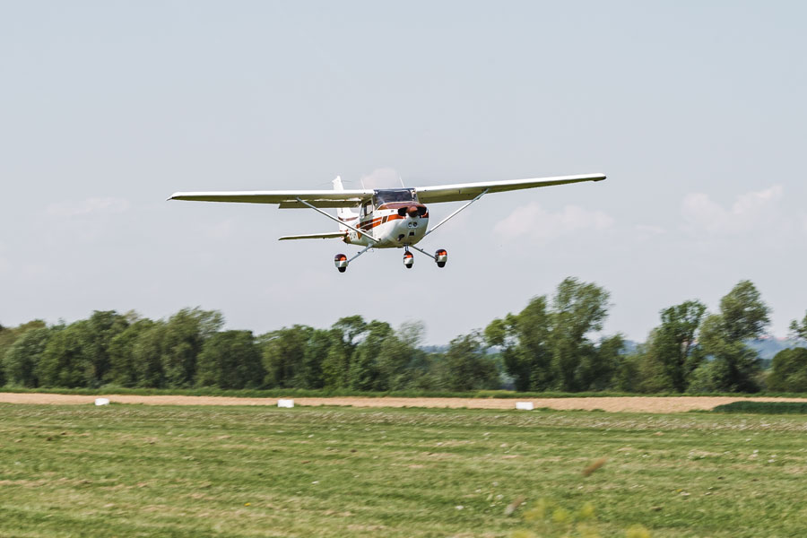 A small single-engine aircraft approaches the runway at Brookhaven Calabro Airport (HWV) in Shirley, New York. The airport serves as a major hub for general aviation on Long Island, supporting private pilots, flight training, recreational flying, and aviation-related businesses.