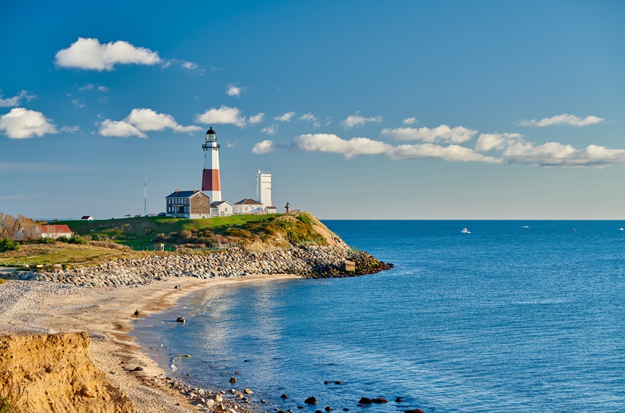 Montauk Point Lighthouse overlooks the Atlantic Ocean from the easternmost tip of Long Island, where rugged bluffs meet the sea. First commissioned by President George Washington in 1792 and placed into service in 1796, the historic lighthouse remains New York State's oldest and continues to serve as one of Long Island's most iconic landmarks and enduring symbols of the East End.