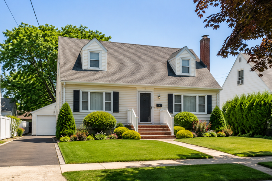 A typical single-family home in Garden City South, featuring the well-maintained landscaping, detached garages, and established suburban architecture commonly found throughout the community. Neighborhoods in Garden City South are known for their tree-lined streets, attractive homes, and convenient central Nassau County location.