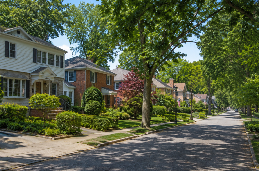A quiet residential street in Great Neck Gardens, New York, features attractive homes, mature shade trees, and meticulously maintained landscaping that reflect the community's welcoming suburban character. Situated on the Great Neck Peninsula, Great Neck Gardens offers a peaceful neighborhood setting with convenient access to parks, shopping, the Long Island Rail Road, and a direct commute to New York City.