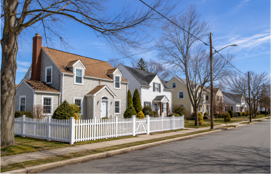 A quiet residential street in Lakeview, New York, features well-maintained single-family homes, mature trees, and sidewalks that reflect the suburban character of this Nassau County community on Long Island.