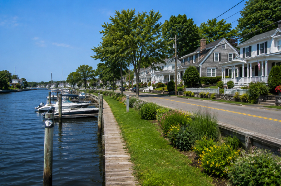 A waterfront neighborhood in Moriches, New York, overlooks the protected waters of Moriches Bay, where marinas, coastal homes, and quiet streets reflect the hamlet's longstanding maritime heritage. Known for its scenic shoreline and relaxed South Shore atmosphere, Moriches offers residents convenient access to boating, fishing, nearby beaches, and the natural beauty of eastern Suffolk County.