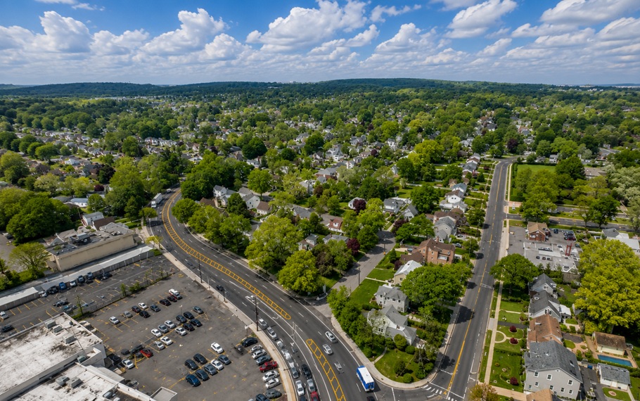 An aerial view of North Hills showcases one of Nassau County's most desirable communities, where quiet residential neighborhoods, tree-lined streets, and major commercial corridors come together in the heart of Long Island's North Shore. Conveniently located near Manhasset, luxury shopping, and several major highways, North Hills offers an exceptional blend of suburban living and regional accessibility.