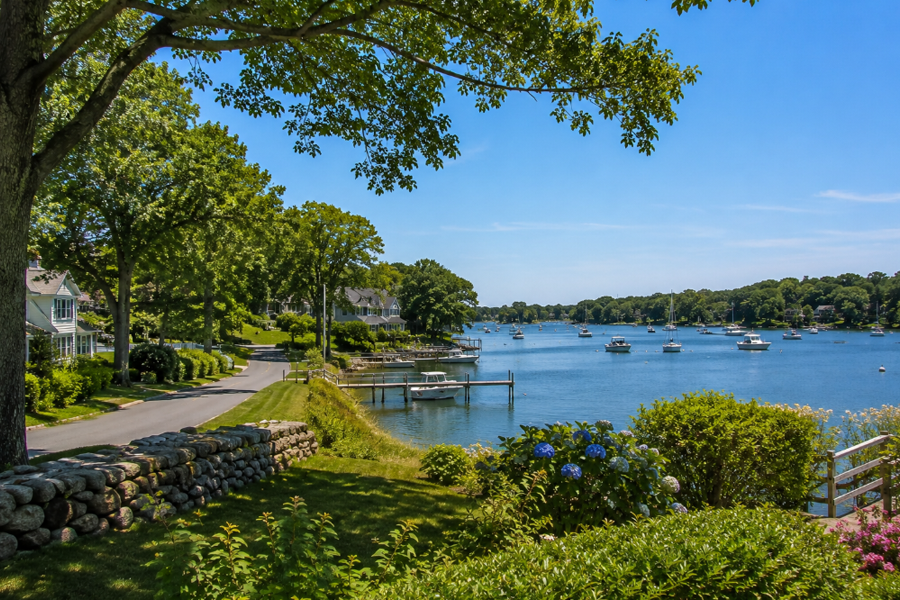 A scenic waterfront neighborhood in Northwest Harbor, New York, overlooks the protected waters of Gardiners Bay, where private docks, anchored boats, and tree-lined shorelines reflect the community's quiet coastal character. Situated between East Hampton and Sag Harbor, Northwest Harbor is known for its peaceful residential setting, natural beauty, and easy access to boating, beaches, and the outdoor recreation that defines Long Island's East End.