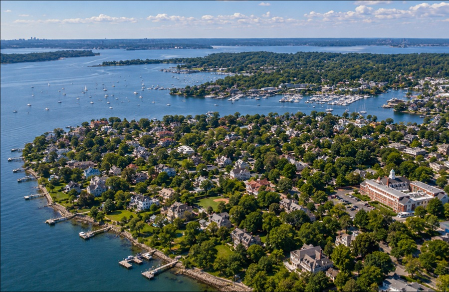 An aerial view of the Great Neck Peninsula showcases one of Long Island's most prestigious North Shore regions, where waterfront neighborhoods, marinas, and tree-lined communities stretch between Manhasset Bay and Little Neck Bay. Known for its scenic shoreline, elegant homes, and convenient access to New York City, the peninsula has long been a defining part of Nassau County's historic Gold Coast.