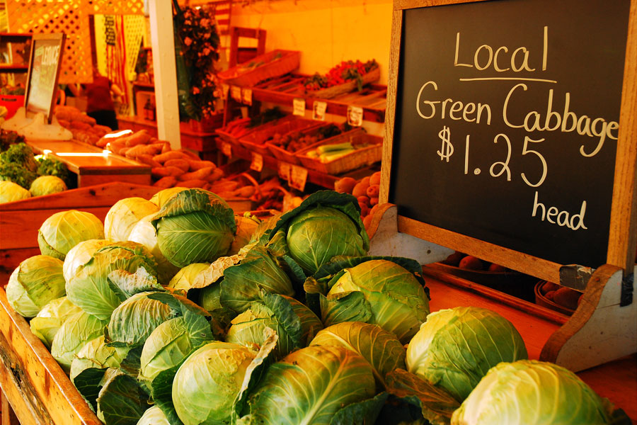 Locally grown fruits and vegetables are displayed for sale at a Long Island farmers market, where seasonal produce, fresh harvests, and farm-direct shopping highlight the region's agricultural heritage. Farm stands and community markets across Nassau and Suffolk counties offer visitors an opportunity to purchase fresh local products while supporting Long Island growers.