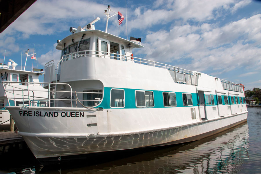 The Fire Island Queen ferry is docked and ready to transport passengers between the Long Island mainland and Fire Island, one of several ferry services that provide convenient access to the island's beaches, villages, and protected natural areas. File photo: WoodysPhotos, licensed.