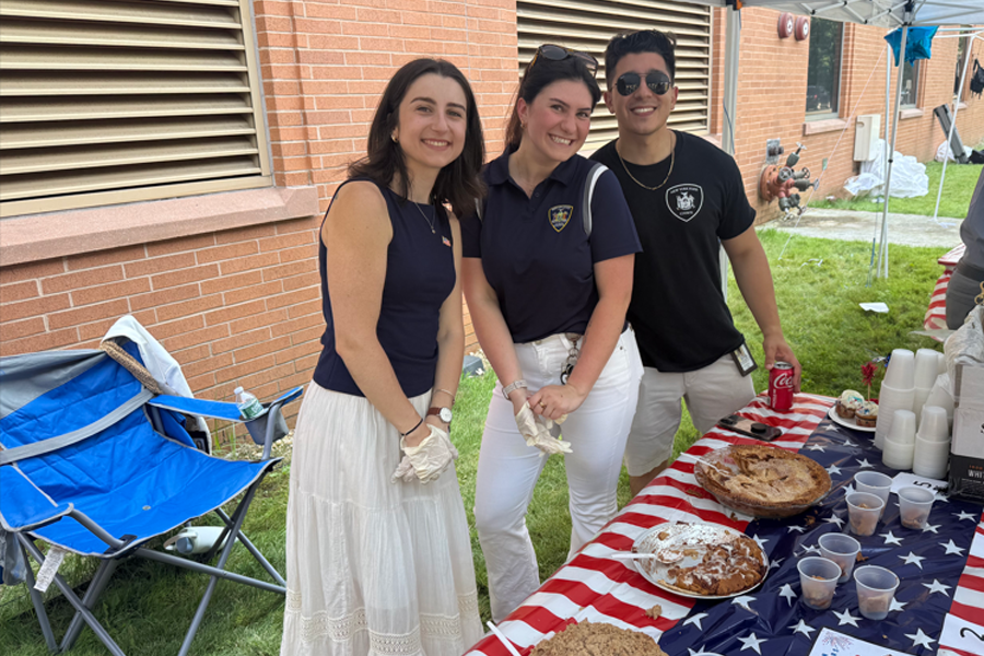 (L-R) Court Analyst Julia Carpenter, Senior Court Analyst Alexandra Imandt, and Justice Coordinator Joseph Benedetto take a break from serving apple pies.