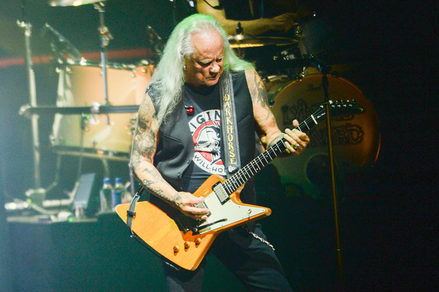 Rickey Medlocke performs on stage with Lynyrd Skynyrd, bringing the band's signature Southern rock sound to life through powerful guitar work and decades of classic hits. Fans attending the Double Trouble Double Vision Tour at Jones Beach can expect an evening filled with legendary performances and timeless rock anthems.