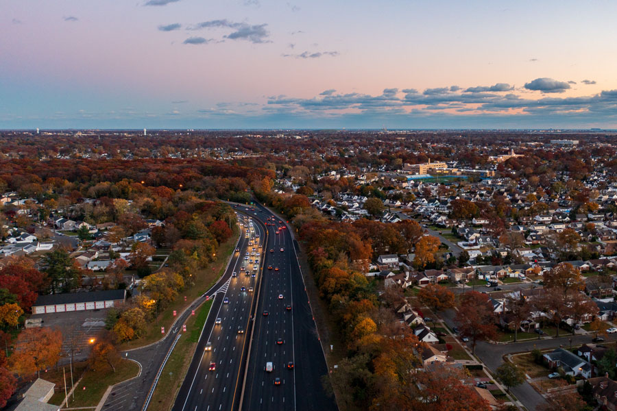 Long Island is the large island immediately east of Manhattan in southeastern New York State. Brooklyn and Queens occupy its western end, Nassau County forms the central suburban portion, and Suffolk County extends east to Montauk and Orient Point, with the Atlantic Ocean to the south and Long Island Sound to the north.