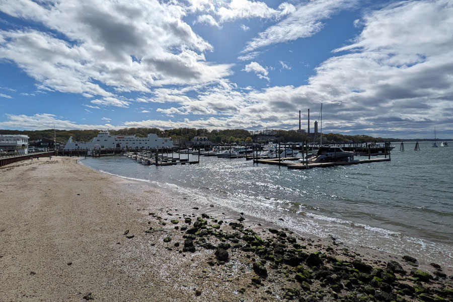 Port Jefferson Harbor's waterfront features marinas, sandy shoreline, and sweeping views of the Long Island Sound, making it one of the North Shore's most popular destinations for boating and recreation. File photo: The Global Guy, licensed.