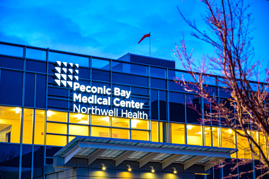The entrance to Peconic Bay Medical Center in Riverhead serves residents and visitors throughout eastern Long Island. As part of the Northwell Health system, the hospital provides emergency care, surgery, cardiovascular services, cancer treatment, women's health, and a wide range of inpatient and outpatient medical services for communities across the East End.