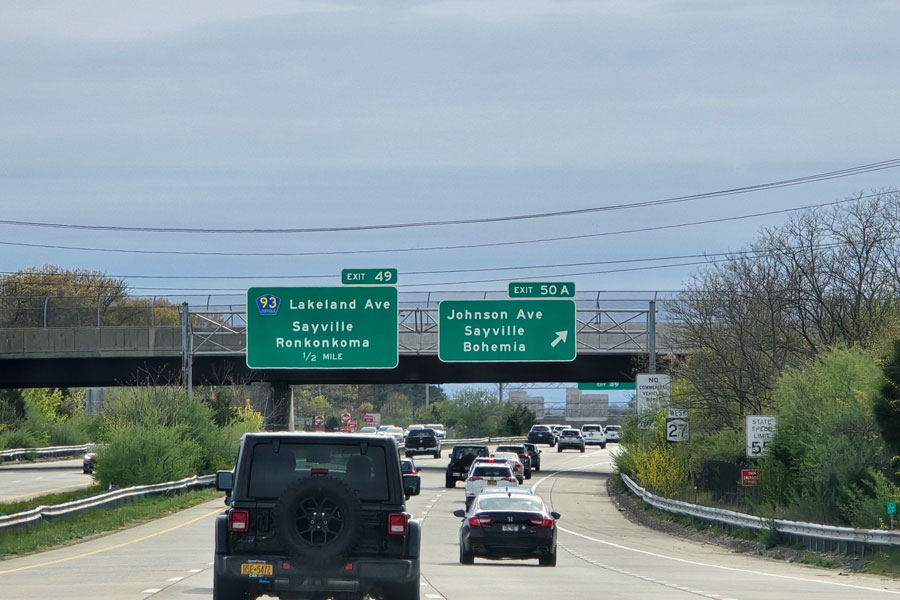 Traffic moves along the Long Island Expressway (Interstate 495), one of the island's busiest highways and a primary route connecting Nassau County, Suffolk County, and New York City. Congestion is common during rush hour, summer weekends, and holiday travel periods. File photo: Patrick Hatt, licensed.