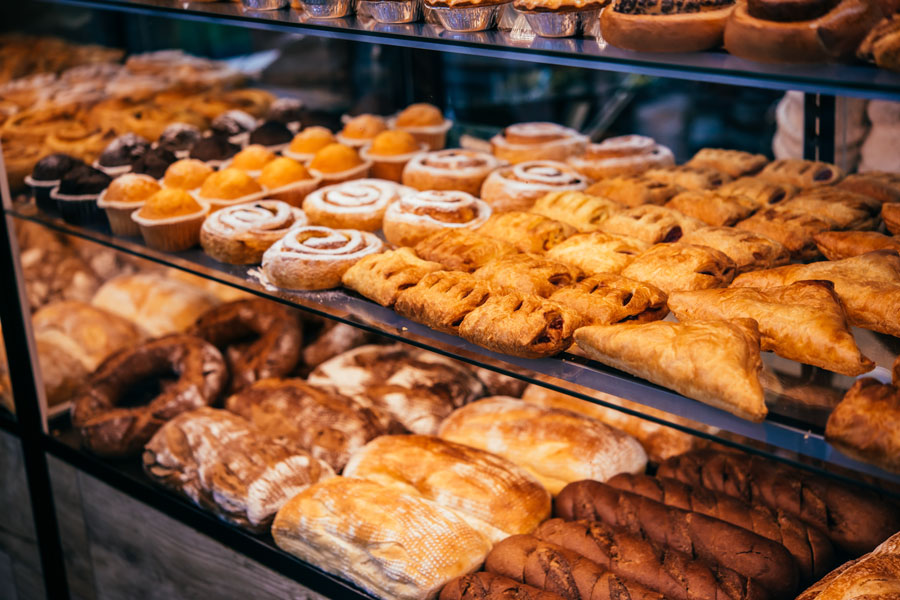A display case filled with fresh artisan breads, flaky pastries, muffins, and baked treats highlights the wide variety of handcrafted goods found in many of Long Island's neighborhood bakeries. From traditional family recipes to modern creations, the island's bakeries continue to delight visitors with fresh baked favorites every day. File photo: fornStudio, licensed.