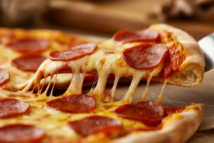 A classic New York-style pepperoni pizza with a crisp, golden crust and melted mozzarella showcases one of Long Island's most beloved comfort foods. From neighborhood pizzerias to family-owned Italian restaurants, great pizza has become a defining part of the island's culinary tradition. File photo: Alex Karlssonn, licensed.
