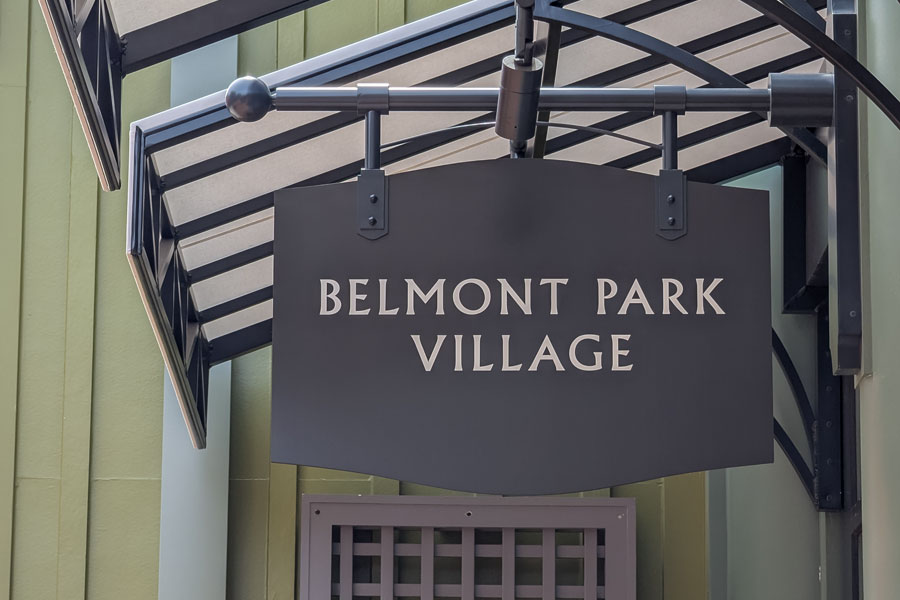 The Belmont Park Village sign welcomes visitors to the newly opened open-air shopping destination in Elmont, New York. The luxury outlet village features designer boutiques, restaurants, and landscaped pedestrian walkways beside UBS Arena and Belmont Park.