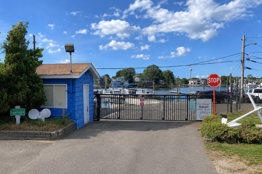 The gated entrance to Lawrence Yacht Club on Yacht Basin Road in Lawrence, New York. The private marina provides boat slips and direct access to the surrounding waterways of Nassau County’s South Shore.