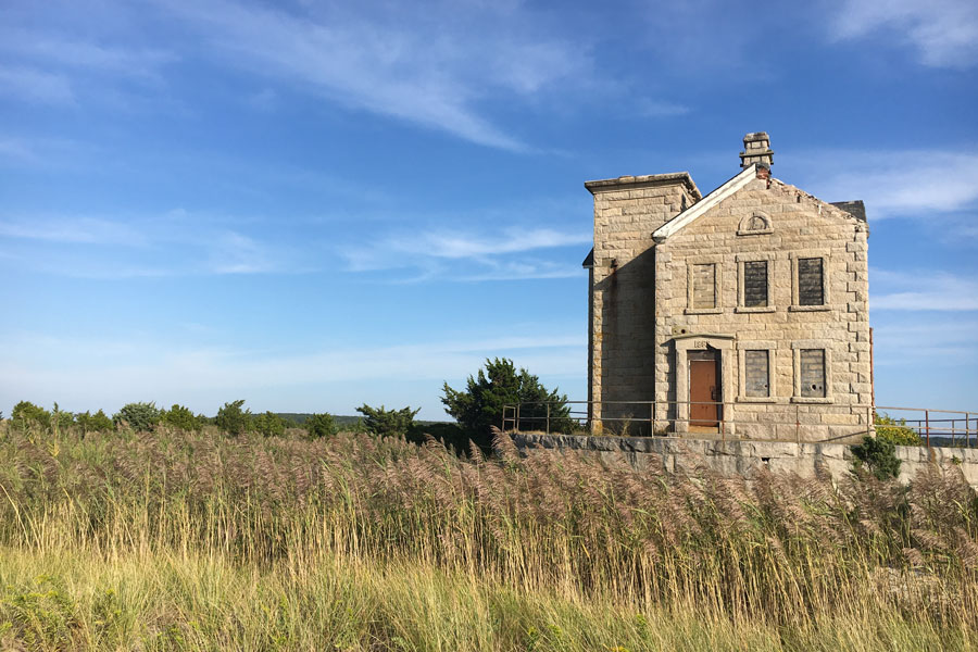 Cedar Island Lighthouse stands amid coastal grasses at Cedar Point County Park on Long Island’s South Fork. The historic granite station overlooks Gardiners Bay and remains a striking reminder of the maritime history of Sag Harbor and eastern Suffolk County.