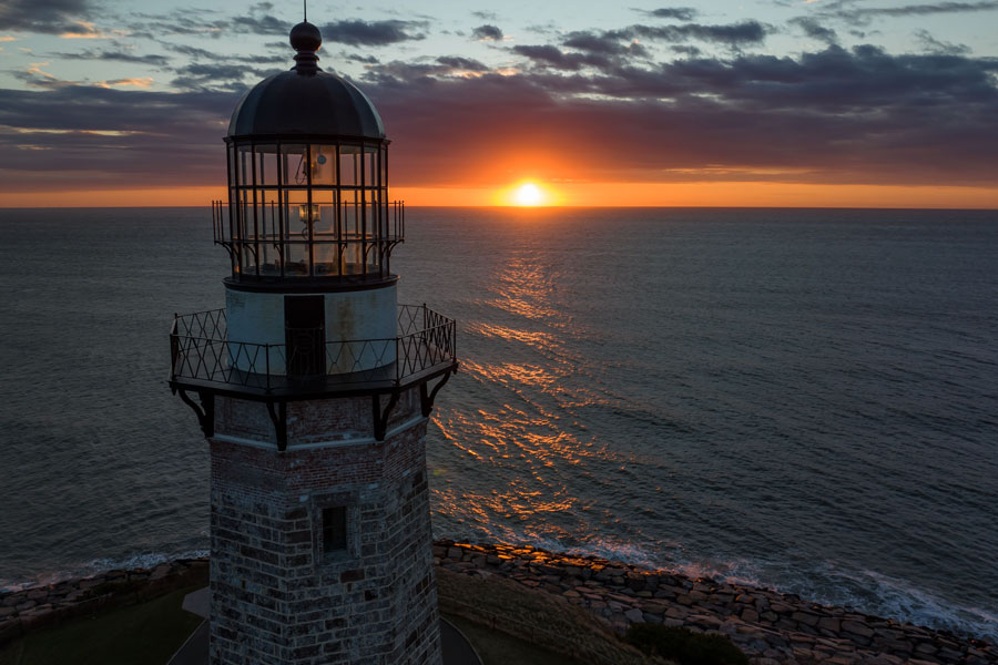 The lantern room of Montauk Point Lighthouse glows against the rising sun at the eastern tip of Long Island in Montauk. Built in the late 18th century, the landmark lighthouse overlooks the Atlantic Ocean and remains one of the Island’s most recognizable maritime sites..