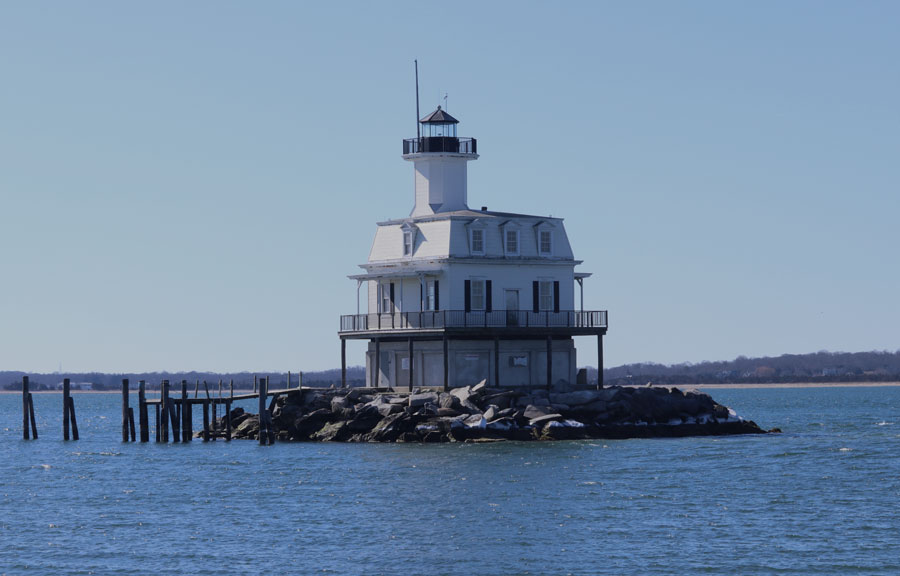Long Beach Bar “Bug” Lighthouse serves as a navigational aid for the hazardous sandbar between Orient Harbor and Gardiners Bay, with its bright beacon guiding vessels into the protected waters of Peconic Bay.