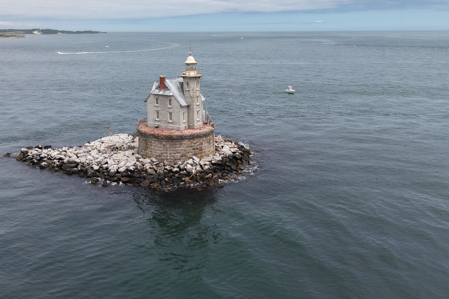 Race Rock Lighthouse stands on a rocky reef in Long Island Sound near Fishers Island, New York. The historic offshore station continues to mark The Race, a passage known for powerful tidal currents and challenging navigation.