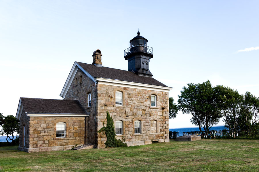 Old Field Point Lighthouse stands on a grassy bluff overlooking Long Island Sound in Old Field, Suffolk County, New York. The historic stone lighthouse and keeper’s dwelling have guided vessels along Long Island’s North Shore since the nineteenth century.