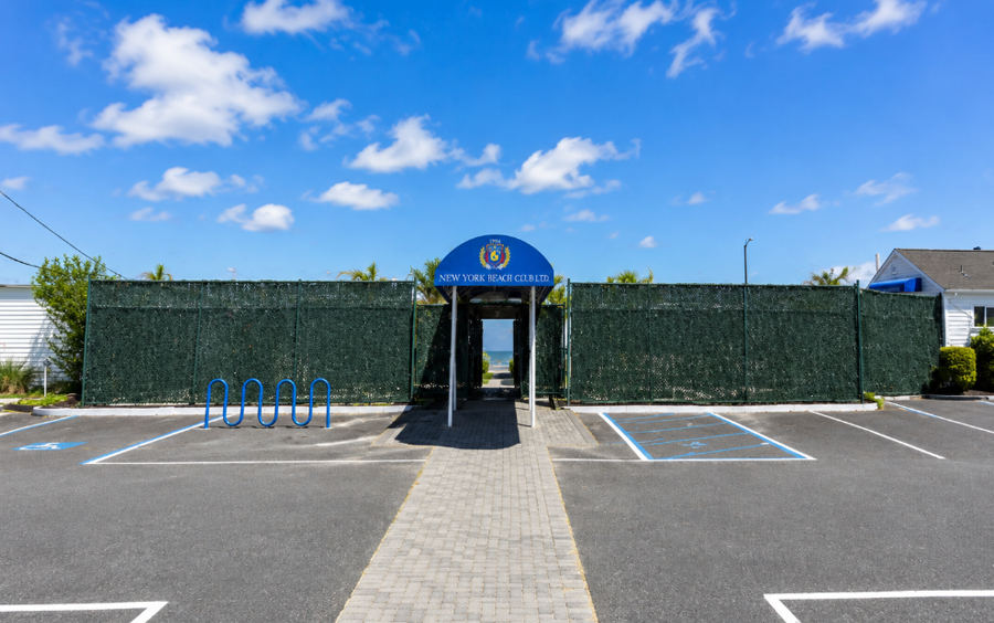 The entrance to the New York Beach Club in Atlantic Beach, a longtime private oceanfront club now being marketed for sale amid ongoing Chapter 11 bankruptcy proceedings. The club remains open and operating during the 2026 summer season.