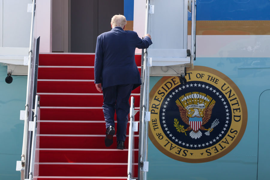 President Donald Trump boards Air Force One in this file photo. Trump is scheduled to visit Nassau County on Friday, August 14, for an event focused on law enforcement and public safety at the Nassau County Police Academy.