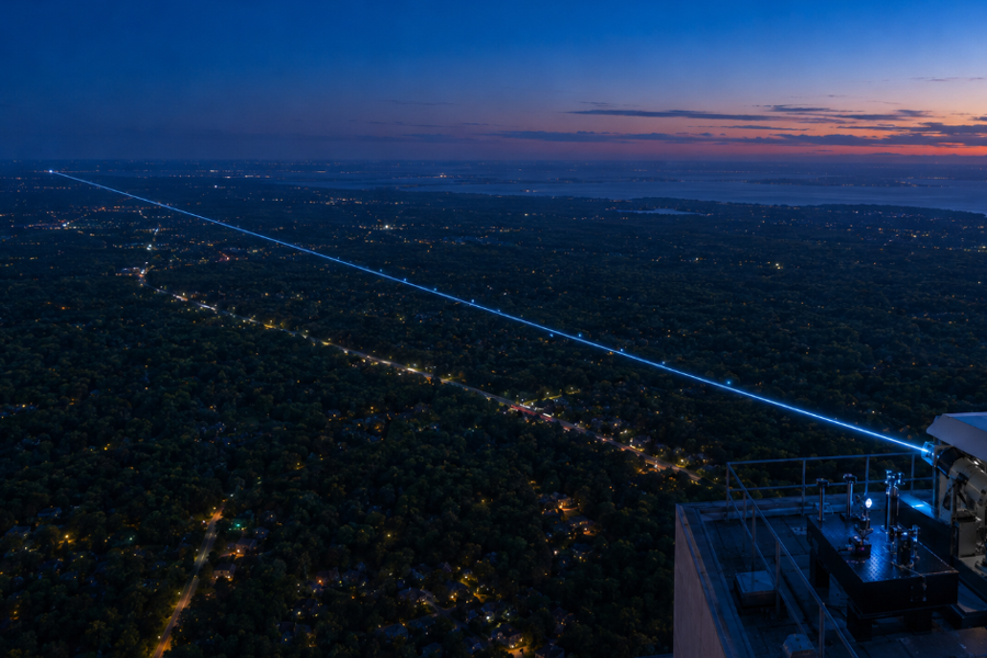 Quantum information travels through an open-air optical link between two research facilities on Long Island. Stony Brook University and Brookhaven National Laboratory researchers successfully transmitted the information approximately 13 miles, completing the first demonstration of its kind in the United States. Fictional illustration.