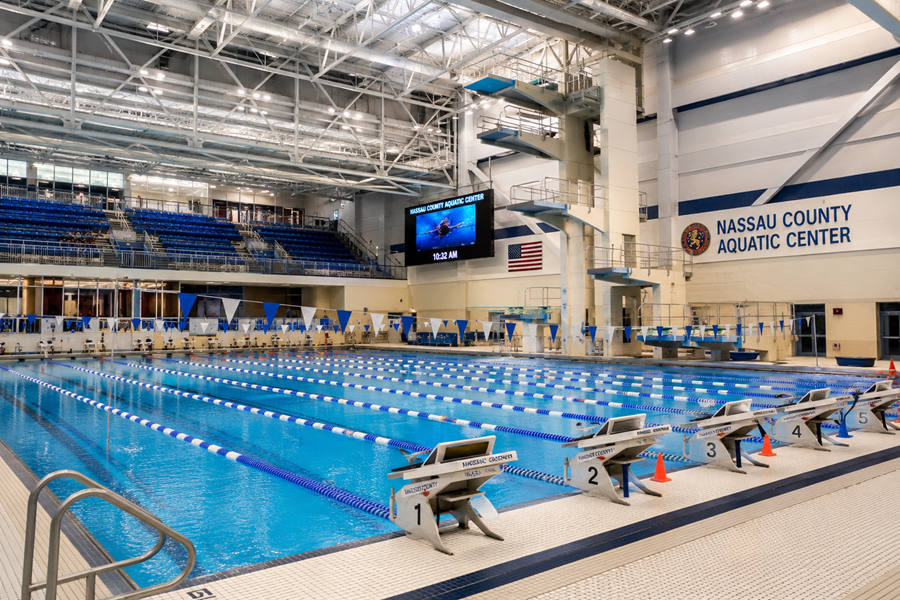 The Nassau County Aquatic Center at Eisenhower Park in East Meadow features a competition-scale swimming pool, spectator seating, and a towering multi-level diving platform. The facility was originally built for the 1998 Goodwill Games and remains one of Long Island’s premier swimming and diving venues.
