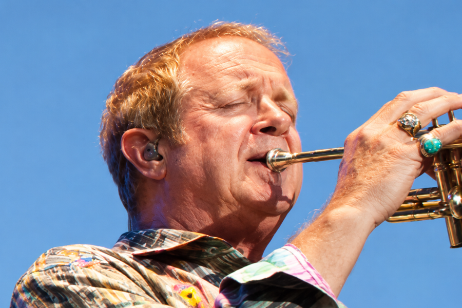 Lee Loughnane, founding member and longtime trumpeter for Chicago, performs during a live concert. Loughnane has been part of the legendary rock band since its formation in 1967 and remains a member of Chicago’s touring lineup nearly six decades later.
