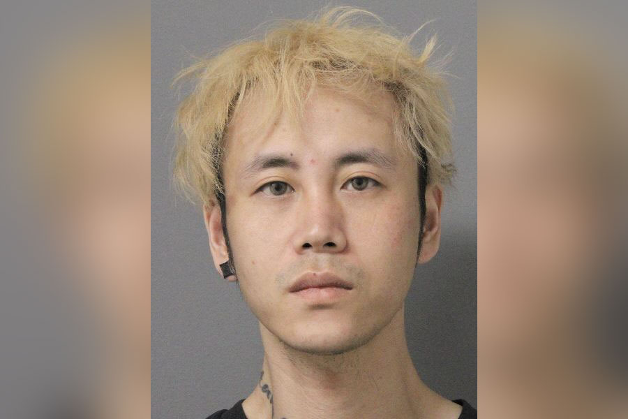 Han Bing Wu, 31, of Flushing, was arrested in Manorhaven after allegedly arriving to collect $18,000 from an 84-year-old woman who had already lost $30,000 in an impersonation scam, according to Nassau County Police. Photo: Nassau County Police Department.
