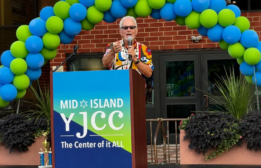 Long Island philanthropist Dr. Harvey Manes speaks at the Mid-Island Y JCC in Plainview, the longtime community center that will be renamed the Manes JCC following his $8 million donation.