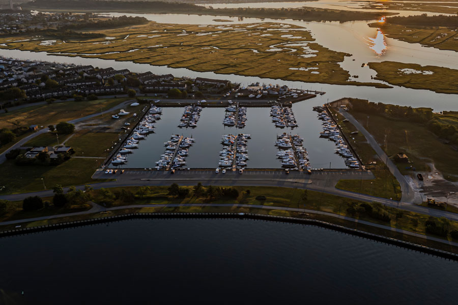 An aerial view of Guy Lombardo Marina in Freeport after a cloudy sunrise shows part of Long Island’s South Shore waterfront. A new U.S. Geological Survey study found that groundwater flooding hazards are generally greater near coasts and surface waters, where the water table lies closer to the ground surface. The study maps regional conditions and does not establish the flooding hazard at this marina or any individual property. File photo: Audley C Bullock, licensed.