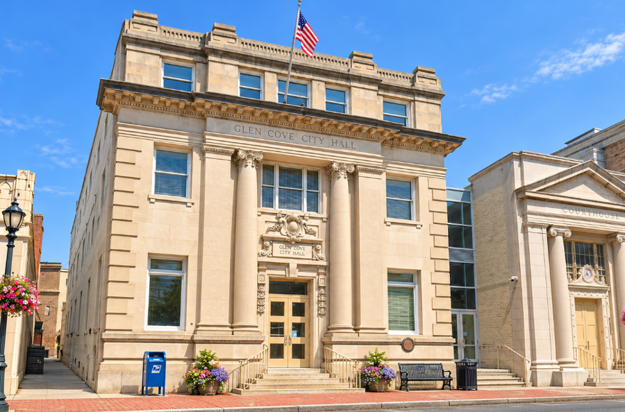 Glen Cove City Hall is depicted in this AI-generated illustration. The city received a score of 47.1 in New York State’s fiscal stress review for local fiscal years ending in 2025, placing it in the “susceptible to fiscal stress” category. Island Park and Huntington Bay also received fiscal stress designations in the review.